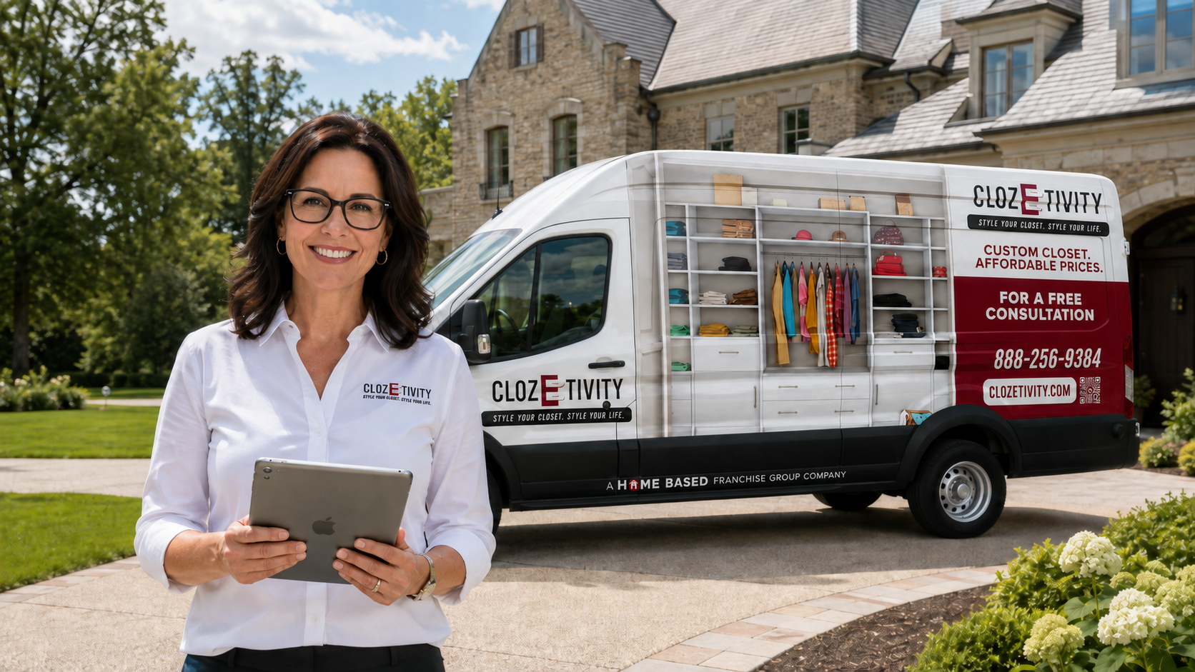 Clozetivity franchise owner holding a tablet in front of a branded van at a luxury home